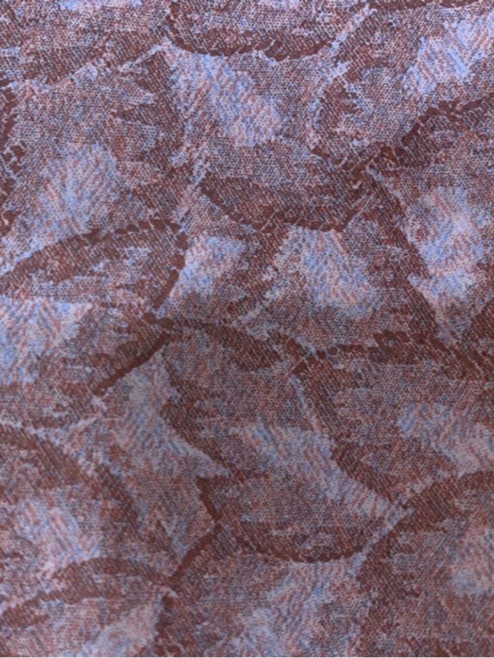 Leaf-Textured vinyl upholstery fabric in pinks w touch of blue.